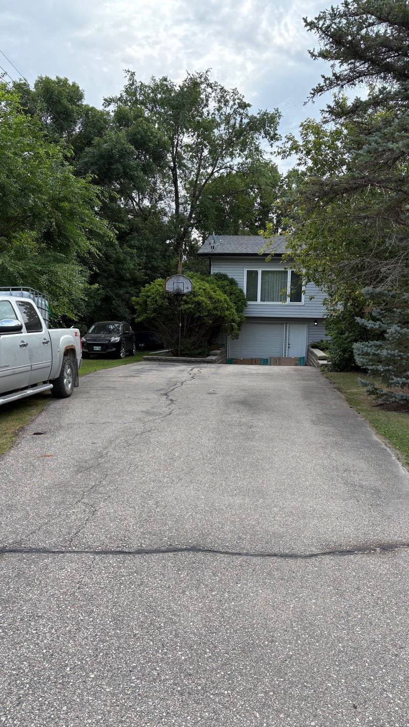 Asphalt Sealcoating project in Stony Mountain — before
